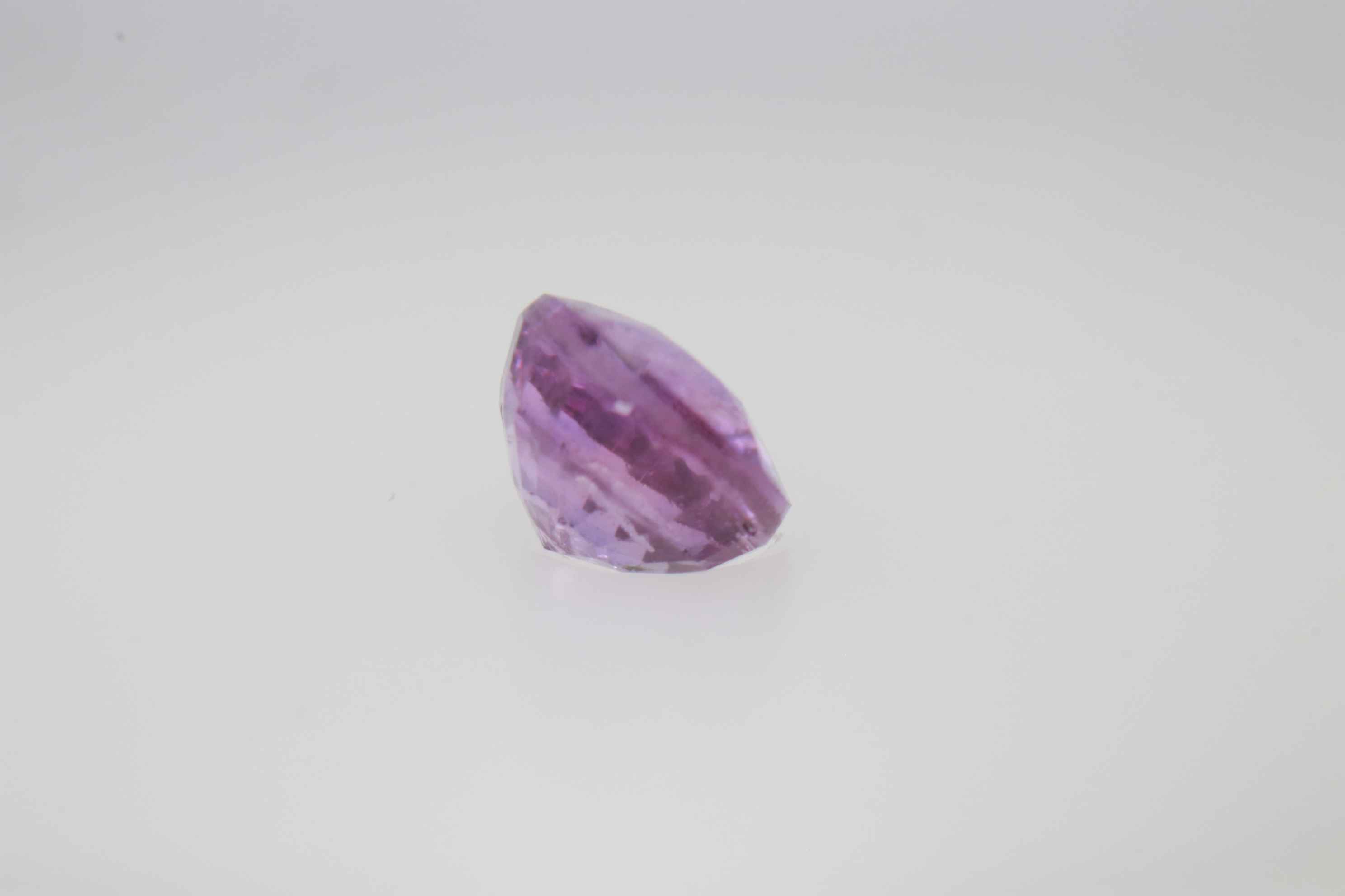 0.9ct Hot Pink Padparadscha VVS Oval Shape (5.8x4.8x3.5 mm) Unheated gemstone from Sri Lanka